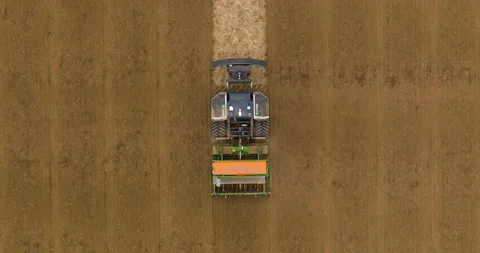 Aerial view autonomous self-driving combine harvester of the future with Stock Footage 276629537