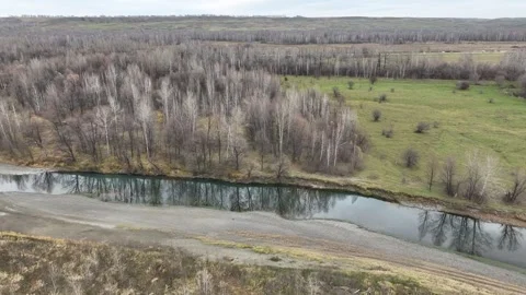 Aerial view autumn bare trees turquoise river 5 Stockbeeldmateriaal 255216625