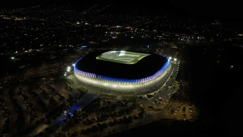 Aerial view away from the BBVA stadium, night in Monterrey, Mexico - Stock Footage 235286560