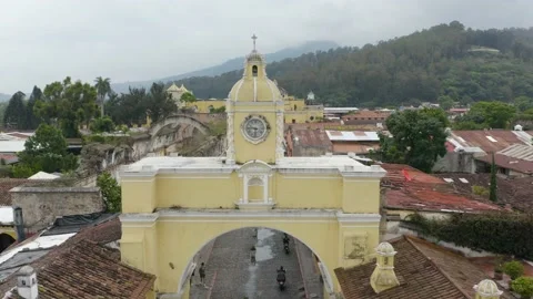 Aerial view away from the clock on the Santa Catalina Arch, in Antigua Stock Footage 226887976
