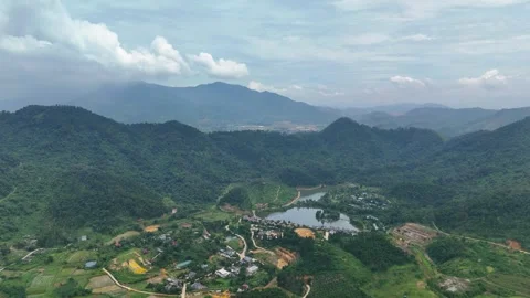 Aerial view of Ba Vi plain in Hanoi with lush green rice fields. Stock Footage 325985438