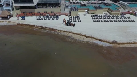 Aerial view of a backhoe on the beach in Playa del Carmen, Mexico Stock Footage 337203429
