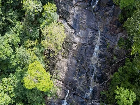 Aerial View Backward Tracking Shot of Remote Waterfall in Koh Phangan Stock Footage 73598809