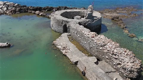 Aerial view backwards from ancient ruins of Venetian castle in the harbor of Stock Footage 331057422