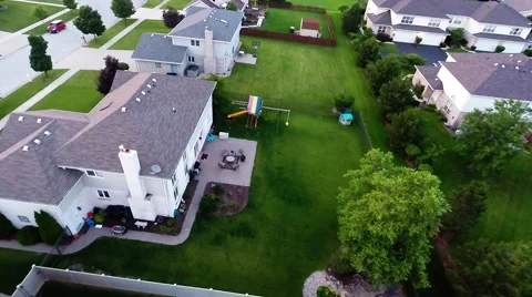 Aerial view of backyard putting green from in air flight above ground Stock Footage 41830251