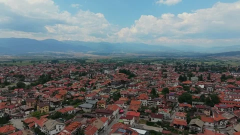 Aerial view of Bansko town with red roofs and mountains in Bulgaria Stock Footage 343642441