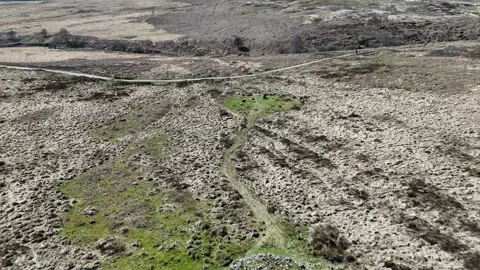 Aerial view of Barbrook I stone circle and cairn on Ramsley Moor Video stock 346236768