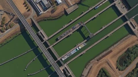 Aerial view of barge navigating krammersluizen locks complex in the netherlands Stock Footage 344051419