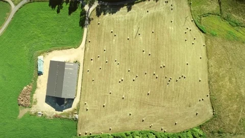 Aerial View of barn and straw bales in field. Stock Footage 345223985