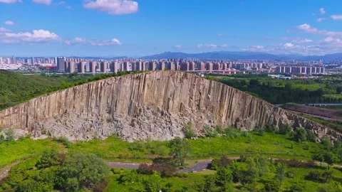 Aerial view of basalt columnar jointing rock formations at Mashan Stone Forest Stock Footage 345630061