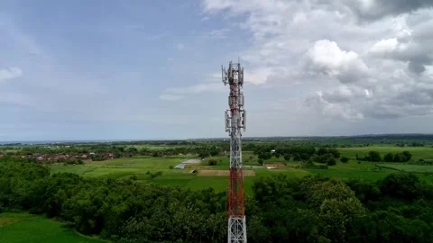 Aerial view of a Base Transceiver Station (BTS) tower or telecommunication tower Stock Footage 329282168