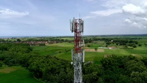 Aerial view of a Base Transceiver Station (BTS) tower or telecommunication tower Stock Footage 329282176