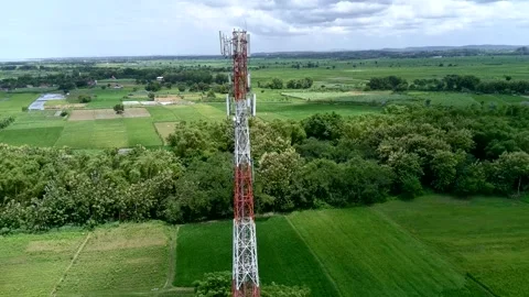 Aerial view of a Base Transceiver Station (BTS) tower or telecommunication tower Stock Footage 329282215