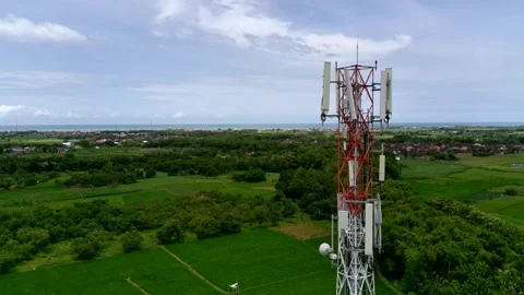 Aerial view of a Base Transceiver Station (BTS) tower or telecommunication tower Stock Footage 329282216