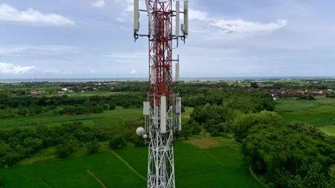 Aerial view of a Base Transceiver Station (BTS) tower or telecommunication tower Stock Footage 329282226