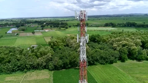Aerial view of a Base Transceiver Station (BTS) tower or telecommunication tower Stock Footage 329282237