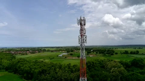 Aerial view of a Base Transceiver Station (BTS) tower or telecommunication tower Stock Footage 329282266