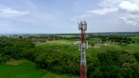 Aerial view of a Base Transceiver Station (BTS) tower or telecommunication tower Stock Footage 329282273