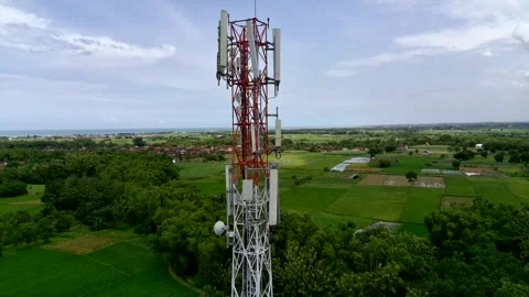 Aerial view of a Base Transceiver Station (BTS) tower or telecommunication tower Stock Footage 329282279