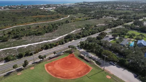 Aerial View of a Baseball Field With Ocean and City Skyline Stock-Footage 345837920
