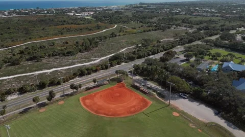 Aerial View of Baseball Field with Red Clay Infield Near the Coast Video stock 327762085