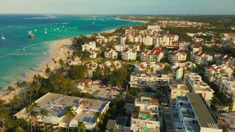 Aerial view of Bavaro area in Punta Cana. Tourist beach cottages, beach, ocean Stock Footage 305555854