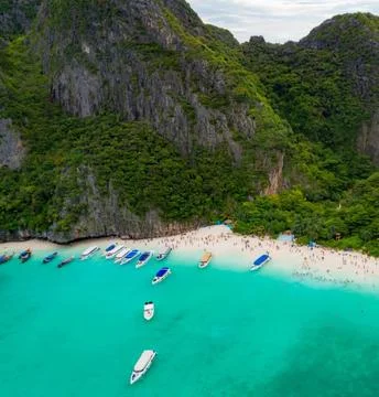 Aerial View of Bay Beach Surrounded by Green Mountains Stock Photos