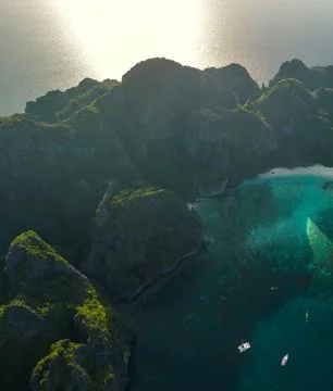 Aerial View of Bay Beach Surrounded by Green Mountains Stock Photos