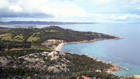 AERIAL VIEW OF THE BEACH OF CALA DI TRANA WITH ITS GOLDEN DUNES 動画素材 108799094