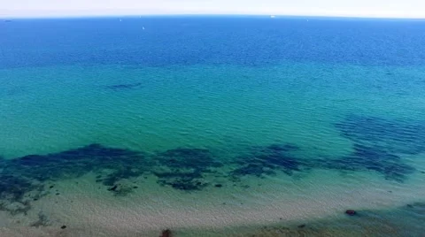 Aerial view of beach with clear blue waters - Aerial view -  birds eye view Stock Footage 62925788