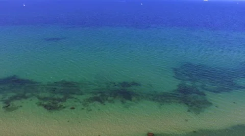 Aerial view of beach with clear blue waters - birds eye view Stock Footage 62926346