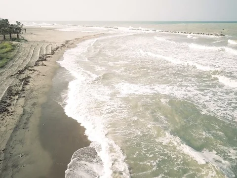 Aerial view of a beach coastline during a bad weather day in spring Stock Footage 75055979