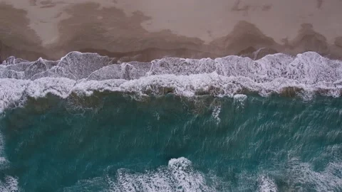 Aerial view of a beach.  Drone top down view of the clear water Stock Footage 169043845
