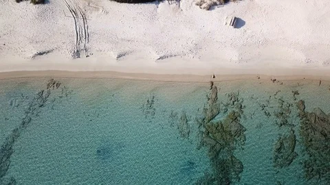 Aerial view of a Beach with flat rocks in the backdrop Stock-Footage 101425187