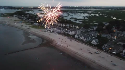 Aerial view of beach party celebration with firework for the 4th of July in Stock Footage 297944665