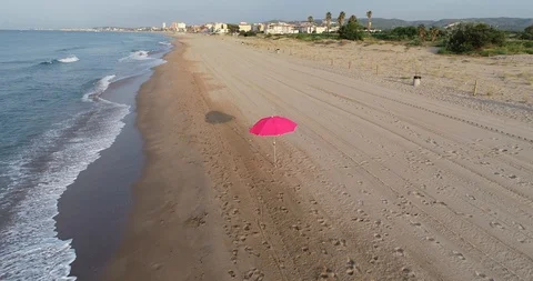 Aerial view of a beach red umbrella Stock Footage 101097579