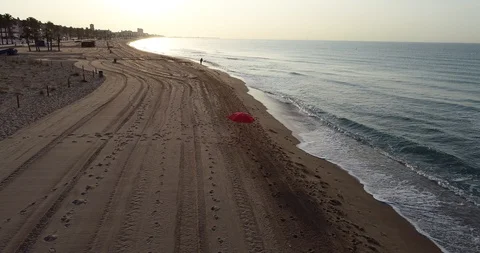 Aerial view of a beach red umbrella Stock Footage 101097603