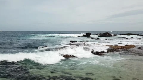 Aerial view of a beach with rocks and waves during the day in Los Cabos Stock-Footage 280445700