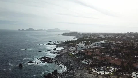 Aerial view of a beach with rocks and waves during the day in Los Cabos Stock-Footage 280445861