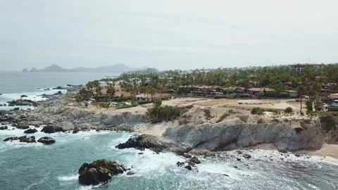 Aerial view of a beach with rocks and waves during the day in Los Cabos Stock-Footage 280446355