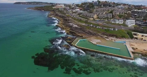 Aerial view on beach side waterfront pool in distance Stock Footage 70825048