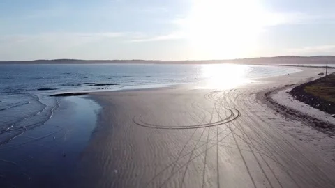 Aerial view of beach at sunset with drone Stock Footage 155313146