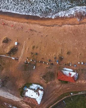 Aerial view of the beach at sunset from a drone Stock Photos