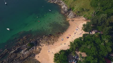 An aerial view of a beach surrounded by trees and a body of water. Yanui beach Video stock 264951414