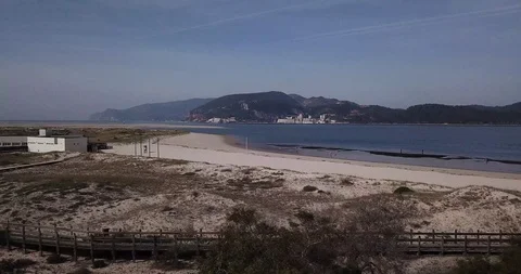Aerial view of beach, trees and landscape in Troia 01, Portugal Stock Footage 115835289