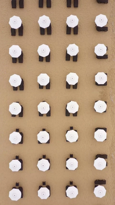 Aerial view to beach umbrellas on the beach in sea resort 스톡 동영상 286303330