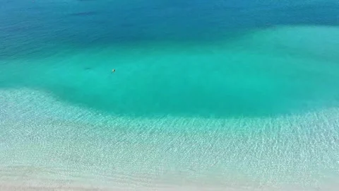 Aerial view with beach in wave of turquoise sea water shot, Stock Footage 240103375