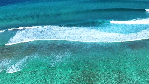 Aerial view with beach in wave of turquoise sea water shot Video stock 243564541