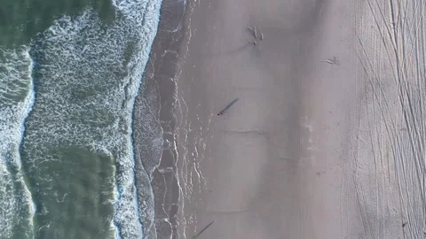Aerial View of Beach with Waves and Shadows, North Sea, Winter, Netherlands Stock Footage 295937155