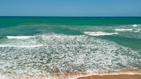 Aerial view of beach waves washing the shore for summer travel Video stock 341375830